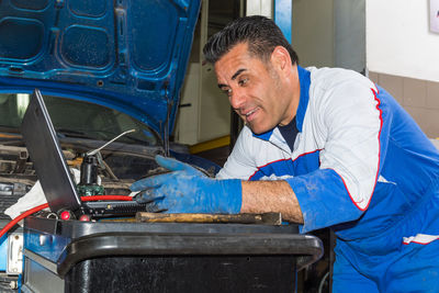 Man working in blue container