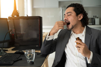 Young man eating food