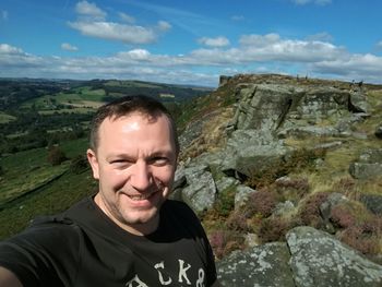 Portrait of smiling man in field