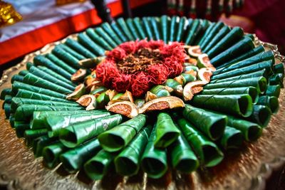 Rolled up betel leaf and nuts been offered as religious offerings