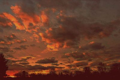 Low angle view of cloudy sky at sunset