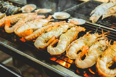 High angle view of meat on barbecue grill