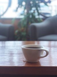 Close-up of coffee cup on table