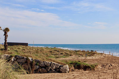 Scenic view of beach against sky