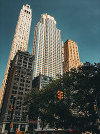 Low angle view of modern buildings against sky