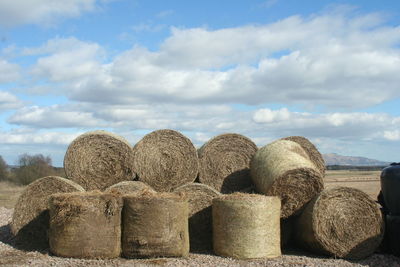 Stack of stones against cloudy sky