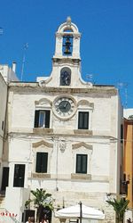 Low angle view of building against blue sky