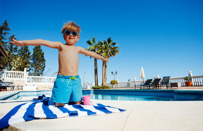 Rear view of man standing in swimming pool