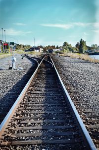 Surface level of railroad tracks against sky