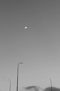 Low angle view of lamp post against clear sky