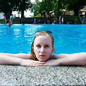 Portrait of woman swimming in pool