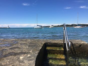 Sailboat on sea against sky