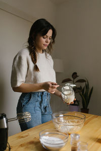 Young woman making christmas cookies