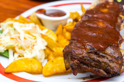 Close-up of grilled pork served in plate