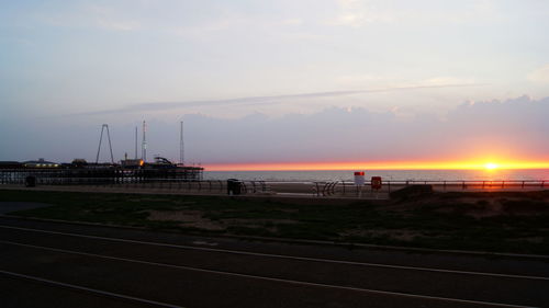 Scenic view of beach against sky during sunset