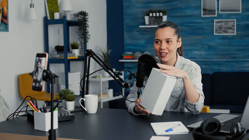 Portrait of young woman working in office