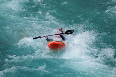 High angle view of man surfing in sea