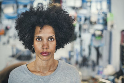 Portrait of confident female mechanic in workshop