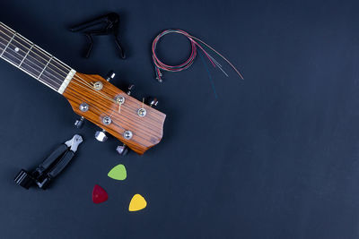 High angle view of guitar on table