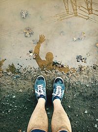 Low section of person standing on ground