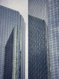 Low angle view of modern buildings against sky in city