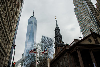 Low angle view of buildings in city against sky