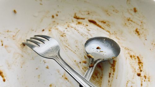 High angle view of fork on table