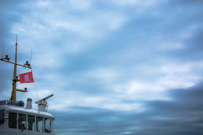 Low angle view of flag against sky