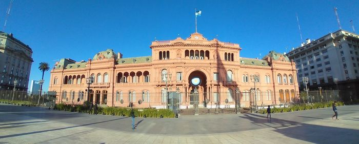 Facade of historic building against clear blue sky