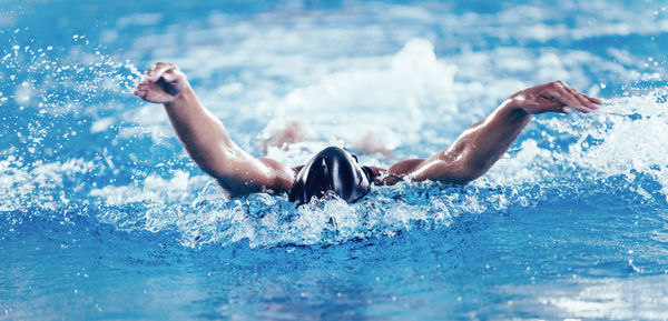 Man swimming in pool