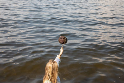 Portrait of woman in lake