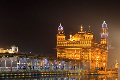 Illuminated buildings in city at night