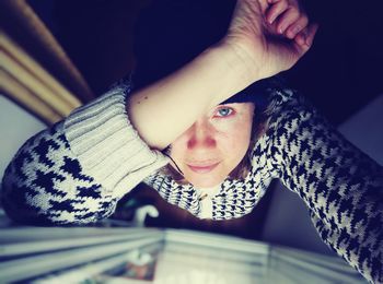 Portrait of boy lying on sofa at home