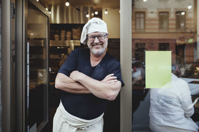 Portrait of man standing in corridor