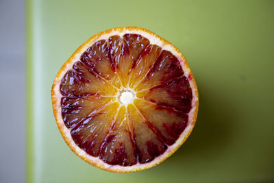 Close-up of orange slice against white background