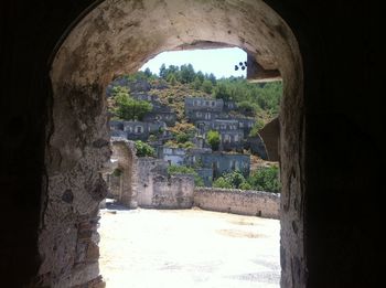 Buildings seen through arch window