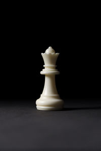 Close-up of chess pieces against black background