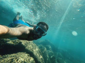 Man swimming in sea