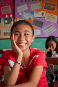Portrait of smiling girl in classroom