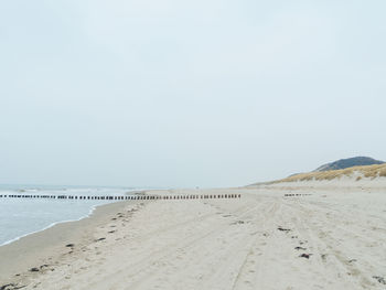 Scenic view of beach against clear sky