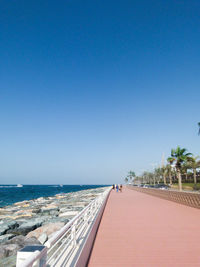 Scenic view of sea against clear blue sky