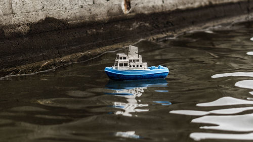 Close-up of toy boat in rippled water