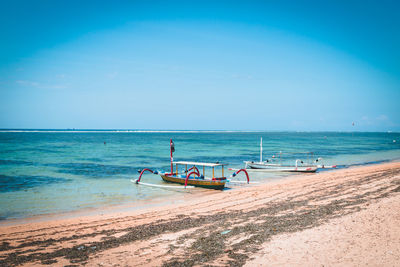 Scenic view of sea against blue sky