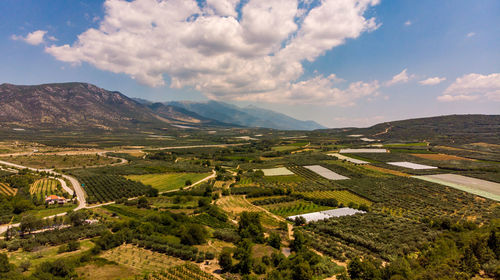 Aerial view of agricultural landscape against sky