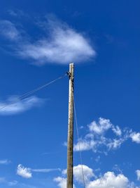 Low angle view of communications tower against sky