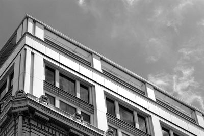 Low angle view of building against cloudy sky