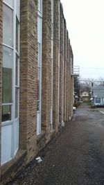 Street amidst buildings against sky