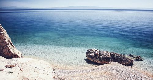 Scenic view of sea shore against sky