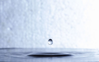 Close-up of splashing water against white background