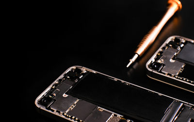 Close-up of computer keyboard against black background